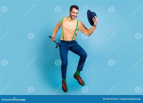 Profile Photo Of Cheerful Guy Jump Hold Cane Take Off Hat Wear Suspenders Shirt Bow Tie Isolated