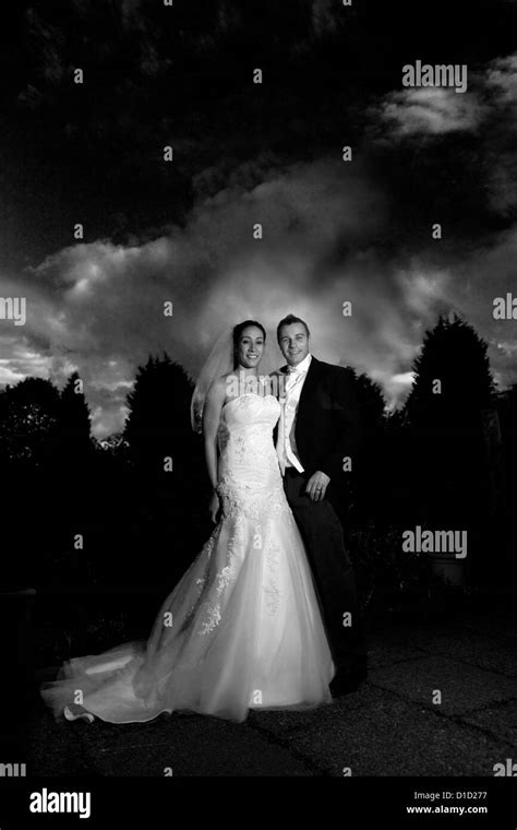 Bride And Groom In Black And White In Dramatic Lighting England Uk