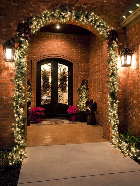 Festive christmas wreath along with a cozy christmas sitting area. 40 Stunning Christmas Porch Ideas