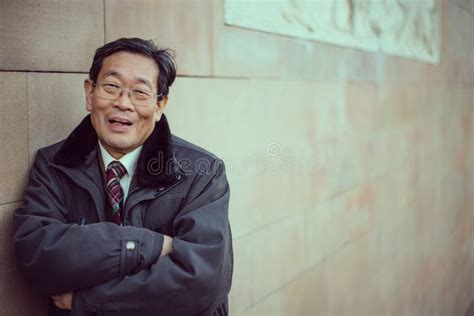 Japanese Senior Old Man Outdoors Smiling And Happy Portrait Stock Photo