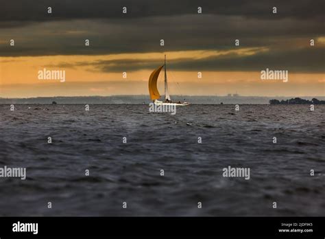 Sailboat In Sea At Stormy Weather Stormy Clouds Sky Orange Sky Sail