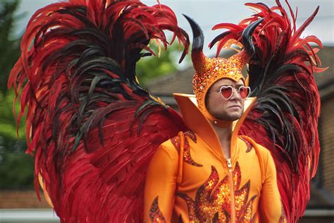 Elton john may have been stuck at the piano for most of his performances, but that never stopped him from moving around. Did Elton John Really Wear That 'Rocketman' Devil Suit?