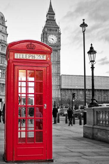 A Traditional Red Phone Booth In London With The Big Ben In A Black And