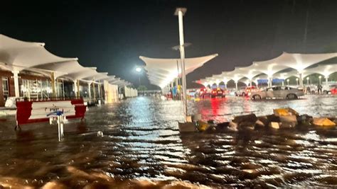 Watch Ahmedabad Airport Flooded Passengers Wade Through Water