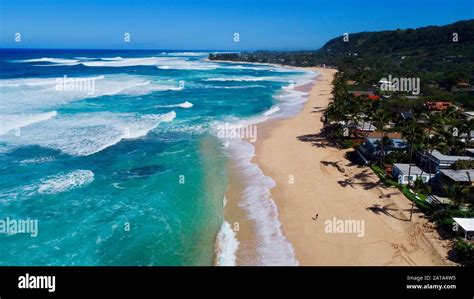 Aerial View Of Bright Blue Water And Surf With Waves Crashing At Bonzai