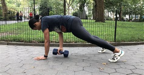 How To Do A Plank With A Dumbbell Pull Through Popsugar Fitness Uk