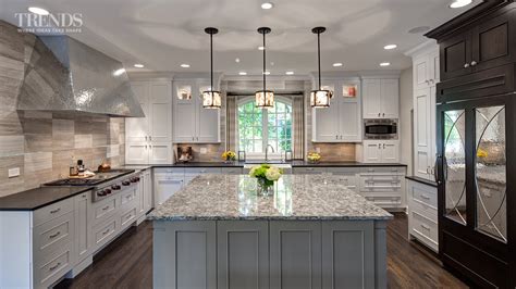 Maybe you would like to learn more about one of these? Large transitional kitchen design has two islands and a ...