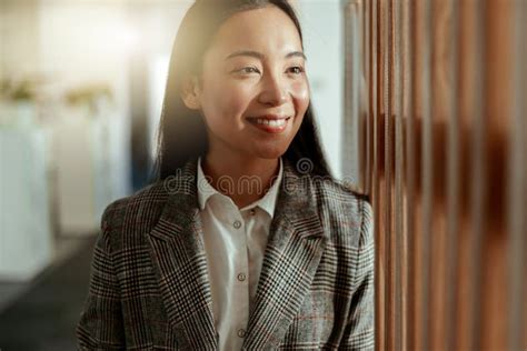 Portrait Of Attractive Asian Business Woman Standing In Modern Office