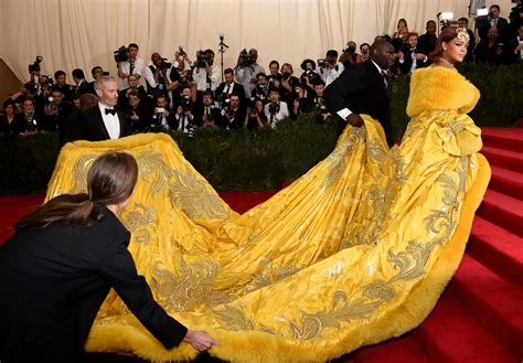 Rihanna Steals The Show In A Gorgeous And Gigantic Gown At The Met Gala