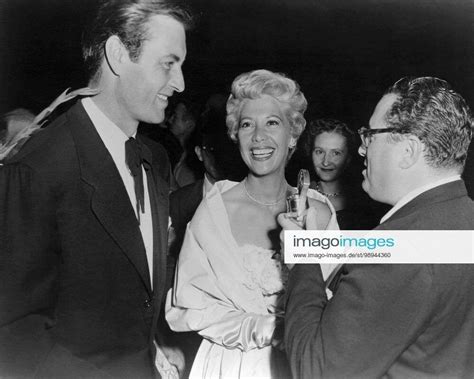 from left husband and wife stars george montgomery and dinah shore interviewed at the premiere of t