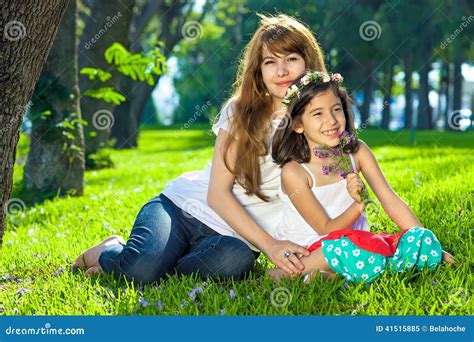 Beautiful Young Girl With Her Mother On Lush Grass Stock Image Image Of Woodland Little 41515885
