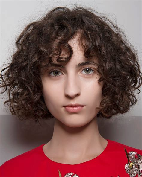 Keep a full fringe sweat free in the heat with a spritz of dry shampoo. 15 Most Outstanding Curly Hairstyles With Bangs 2019 ...