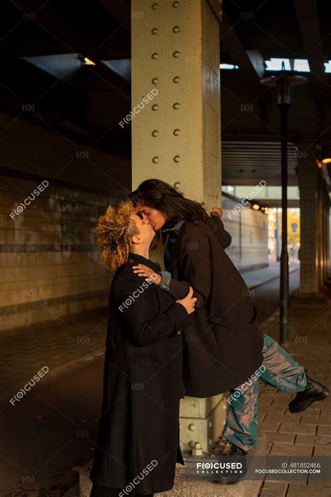 Lesbian Couple Kissing Under Bridge At Night — Friends Lgbtqi Stock