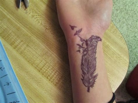 57 Attractive Wrist Feather Tattoos