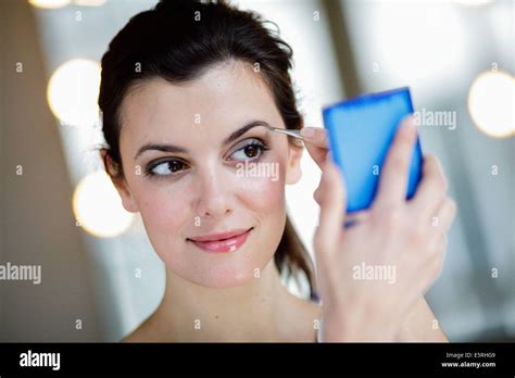 Woman Depilating The Eyebrows Stock Photo Alamy