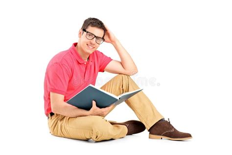 Young Man Sitting On Floor And Reading A Book Stock Photo Image Of