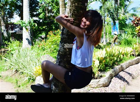 Woman Climbing Tree Hi Res Stock Photography And Images Alamy