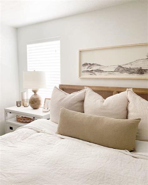 Neutral Master Bedroom With White Bedding And Landscape Art Neutral