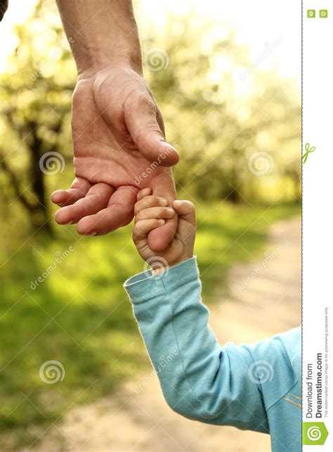Parent Holds The Hand Of A Small Child Stock Photo Image Of