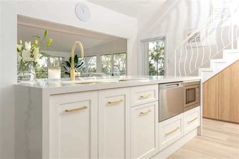 Caesarstone® Calacatta Nuvo™ kitchen island by Kenross Kitchens. Designer: Diana Harding ...
