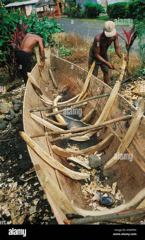 Carib Indians Build Boat By Roadside In Their Village In The Carib
