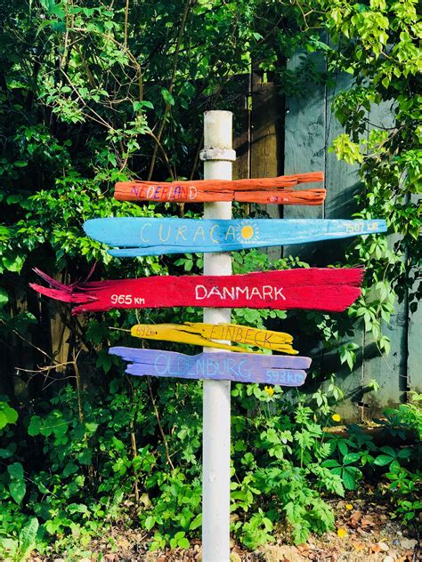 Driftwood is wood that has been washed onto a shore or beach of a sea, lake, or river by the action of winds, tides or waves. Colourful driftwood signs | Driftwood signs, Beach signs ...