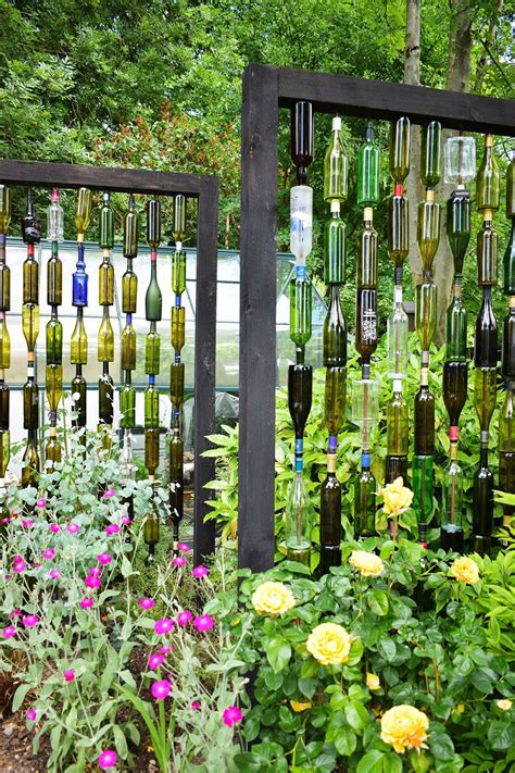 Wine bottle garden walls, fences, and gates made with different colored bottles really catch the sunlight. How to make a wine bottle screen garden feature | Diy ...