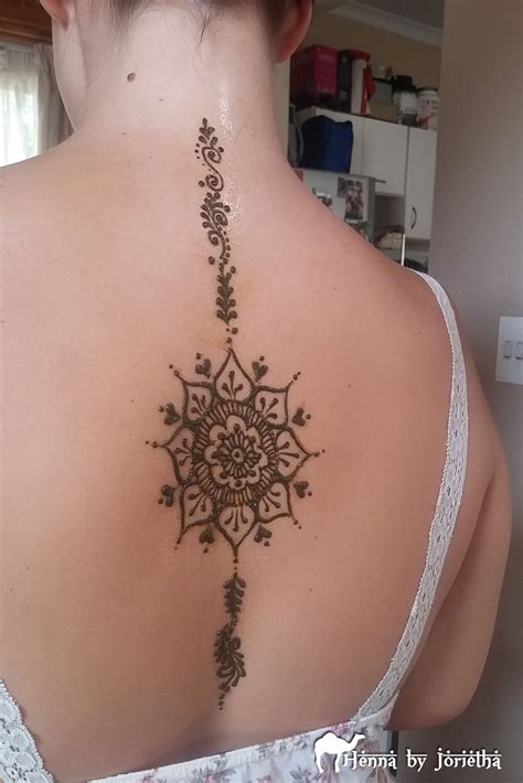 Lower back offers a lot of wide, smooth space for tattooing tattoos. Henna Mandala Back | Henna tattoo designs, Neck tattoo ...