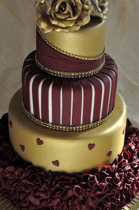 Gold And Burgundy Wedding Cake With Ruffles And Roses