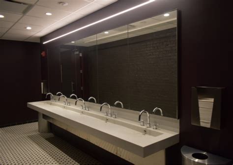 Hand dryers (or paper towels) next to the sink. The Four Most Important Design Trends for Commercial Restrooms - Neo Metro