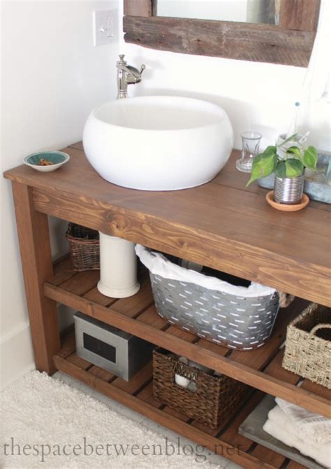 Touch device users, explore by touch or with swipe gestures. DIY wood vanity in the master bathroom