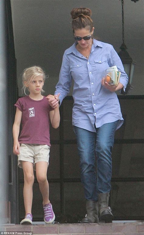 — waterhouse (@pentrarto) november 12, 2014. Julia Roberts' pretty blonde mini-me daughter Hazel snuggles into her famous mother as they step ...