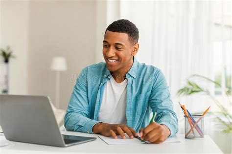 Glad Handsome Young African American Man Manager In Casual Use Computer