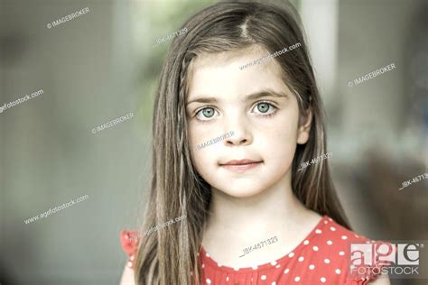 6 Year Old Girl Looks Into The Camera Portrait Germany Europe Stock