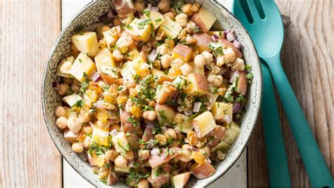 In a large bowl, toss together carrots, raisins, peanuts, coriander, and spring onions. Curried Potato Salad with Golden Raisins and Chickpeas ...