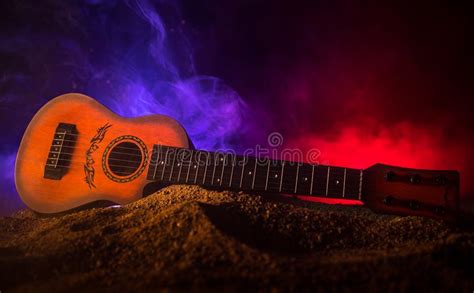Music Concept Acoustic Guitar Isolated On A Dark