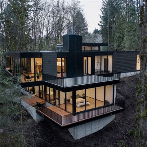 Black Wood And Glass Volumes Stagger Down Oregon Woodland To Form Royal House Architecture
