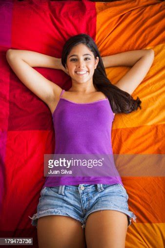 Teenage Girl Lying In Bed Smiling Bildbanksbilder Getty Images