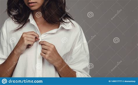 Woman Undressing Against Grey Background Stock Image Image Of