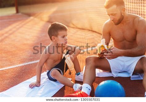 Shirtless Father Son Sitting On Court Stock Photo 1305507031 Shutterstock