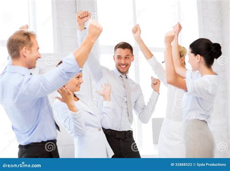 Business Team Celebrating Victory In Office Stock Photo Image Of