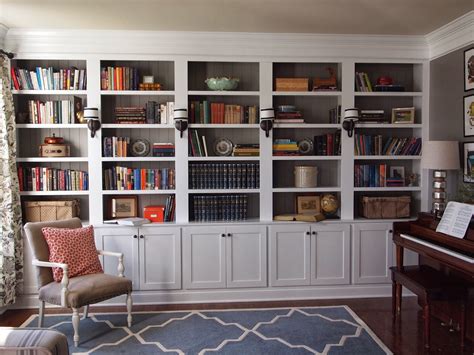 We decided that closed storage down below with open shelves up top would be a nice look and give us hidden storage and a place to display things. Right up my alley: Library Reveal