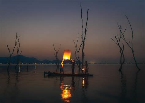 Premium Photo Fisherman Floating Lamp On Wooden Boat In Lake
