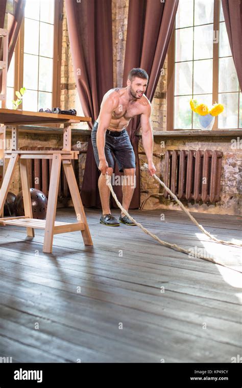 Young Man Sweaty Working Out With Battle Ropes Stock Photo Alamy