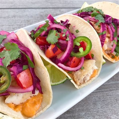 Make the fish taco sauce. Crispy Fish Tacos with fresh Cabbage Slaw & Sriracha Aioli ...