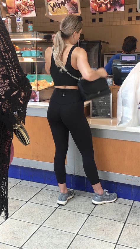 Fit Blonde Standing In Line Wearing Lululemon Spandex Leggings