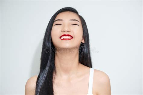 Young Beautiful Asian Woman With Smiley Face And Red Lips Stock Image