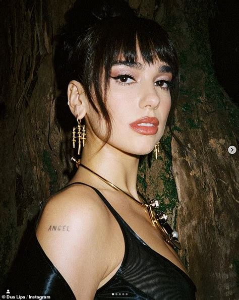 Dua Lipa Flaunts Sensuality In Sultry Photos Showcasing Cleavage In A