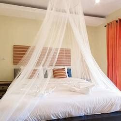 I made a canopy over my daughter's bed by sawing a hula hoop in half. What Kind of Fabric For Bed Canopy? (How Much + How To Tips)