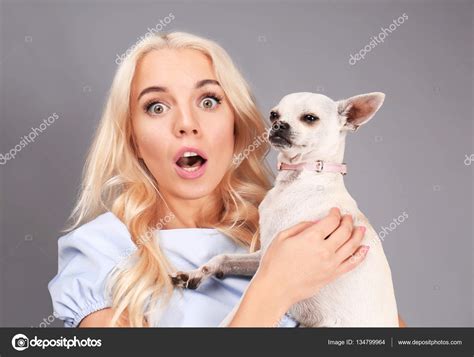 Girl Holding Cute Dog — Stock Photo © Belchonock 134799964